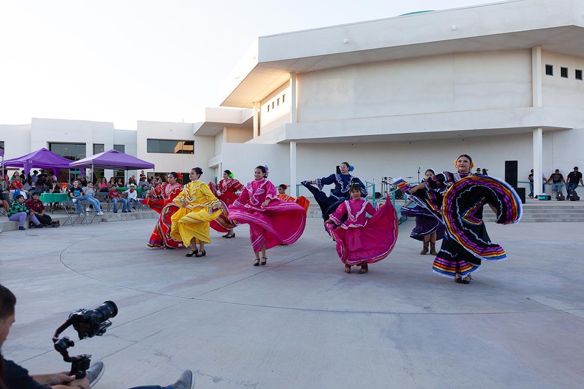 San Juan College hispanic students in traditional dress dancing at the Fiesta at Sunset event held by the Herencia Latina Center at San Juan College.